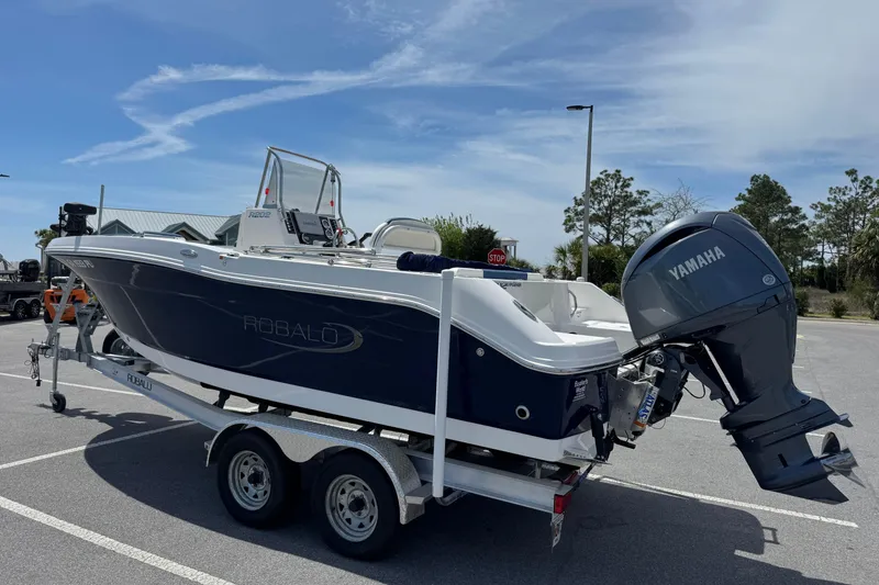 Slide: The Image of 2023 Robalo R202 Explorer boat on trailer with Yamaha outboard motor. - 5