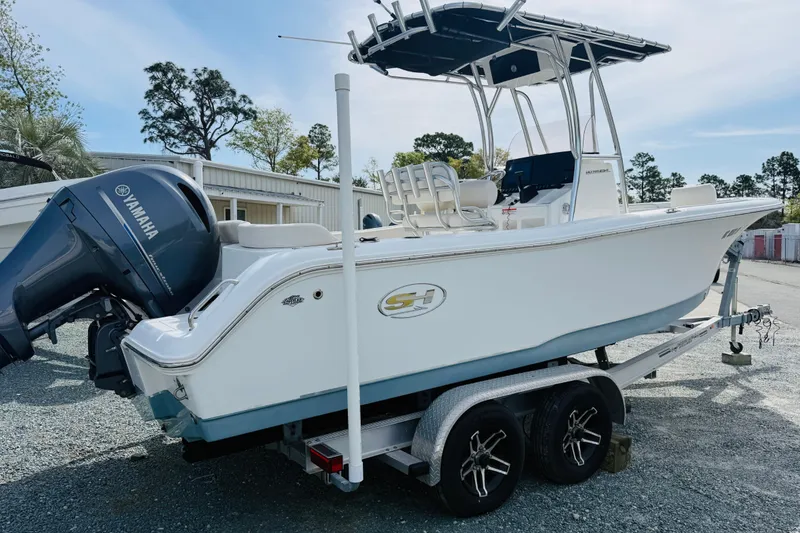 Slide: The Image of 2022 Sea Hunt Ultra 234 boat on trailer with Yamaha outboard motor. - 2
