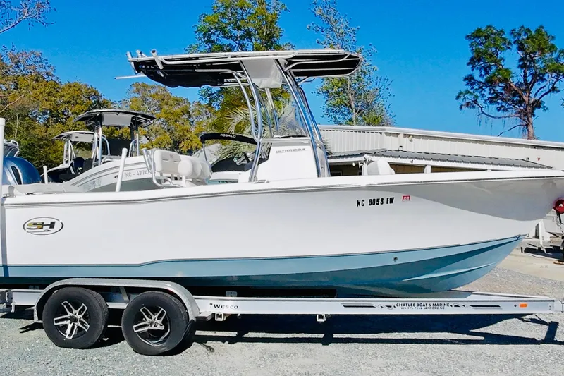 Slide: The Image of 2022 Sea Hunt Ultra 234 boat on trailer, parked outdoors. - 8