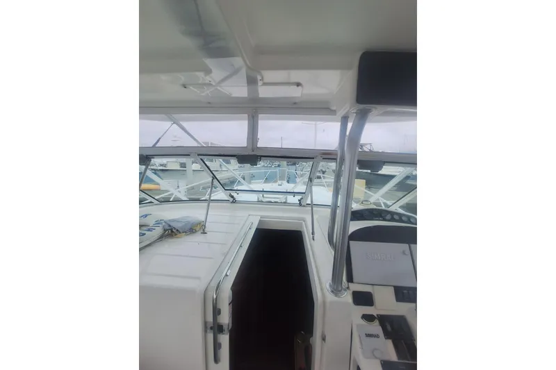 Slide: The Image of 2004 Luhrs 38 Open boat interior with helm and navigation equipment. - 10