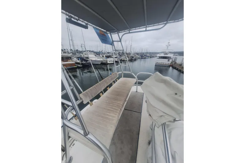 Slide: The Image of 2004 Luhrs 38 Open boat with seating, docked in a marina. - 14