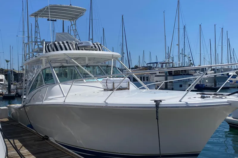 Slide: The Image of 2004 Luhrs 38 Open yacht docked at marina, clear sky background. - 18