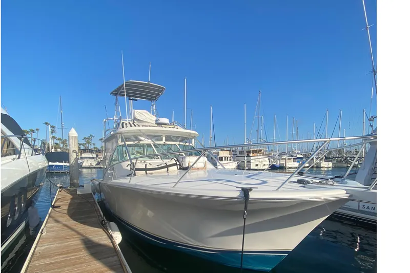 Slide: The Image of 2004 Luhrs 38 Open yacht docked at marina under clear blue sky. - 20