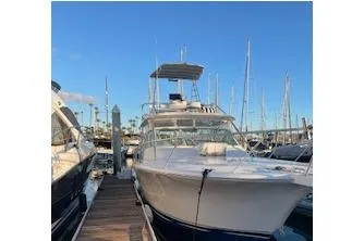 Slide: The Image of 2004 Luhrs 38 Open yacht docked at marina under clear blue sky. - 23