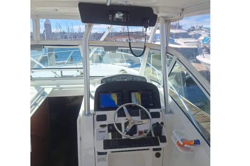 Slide: The Image of 2004 Luhrs 38 Open yacht helm station in harbor. - 24