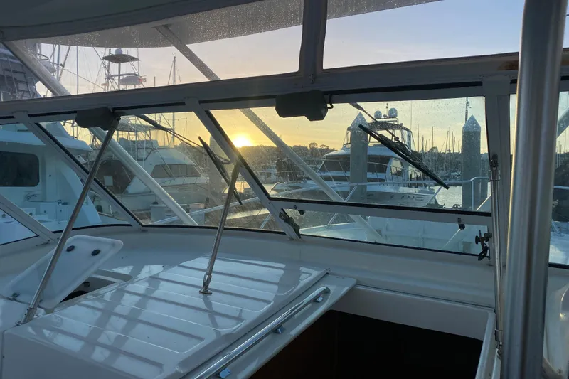 Slide: The Image of 2004 Luhrs 38 Open boat interior with marina sunset view. - 25