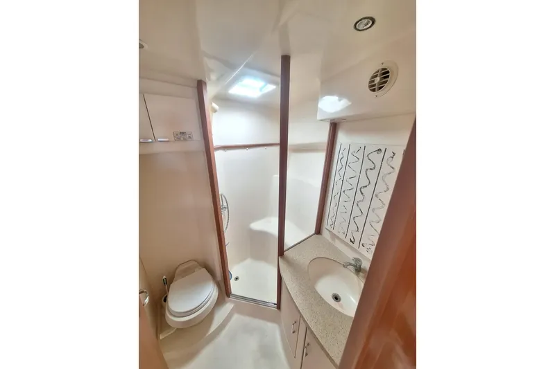 Slide: The Image of Interior view of the head in a 2004 Luhrs 38 Open yacht. - 36