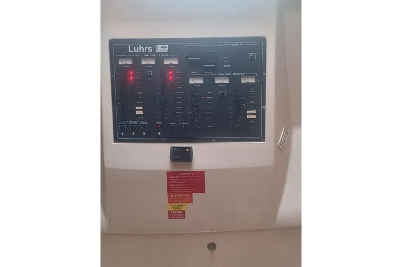 Slide: The Image of Electrical control panel on a 2004 Luhrs 38 Open boat. - 38