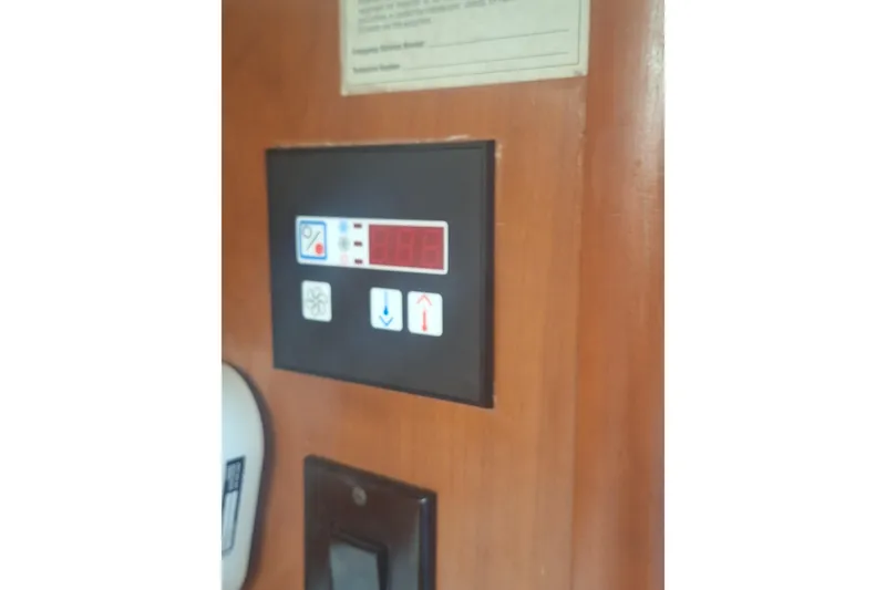 Slide: The Image of Control panel on 2004 Luhrs 38 Open boat interior wall. - 39