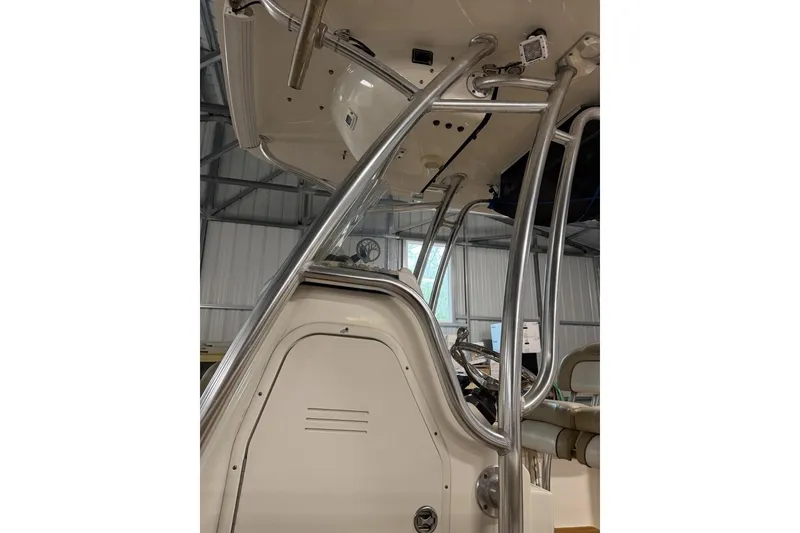 Slide: The Image of 2016 Key West 244 Center Console boat interior with metal framework and console details. - 10