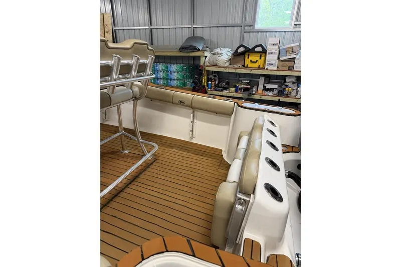 Slide: The Image of 2016 Key West 244 Center Console boat interior with seating and storage. - 16