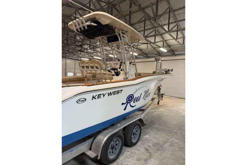 Slide: The Image of 2016 Key West 244 Center Console boat on trailer in storage facility. - 3