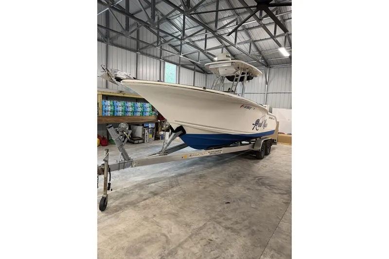 Slide: The Image of 2016 Key West 244 Center Console boat on trailer in storage facility. - 4