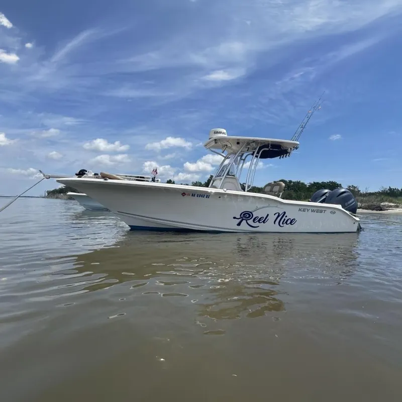 The Image of 2016 Key West 244 Center Console boat on calm water. - 0
