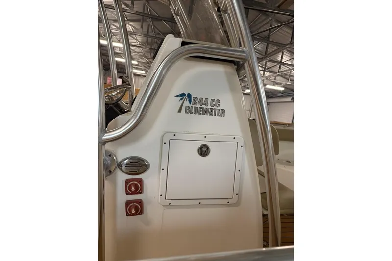 Slide: The Image of 2016 Key West 244 Center Console boat interior with control panel and storage compartment. - 11