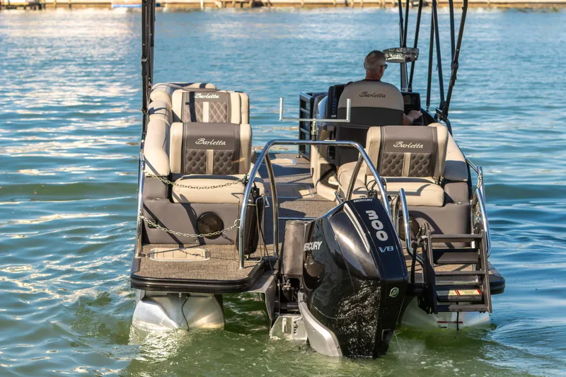 Slide: The Image of 2024 Barletta L23U pontoon boat with Mercury 300 V8 engine on a sunny lake. - 23