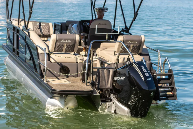 Slide: The Image of 2024 Barletta L23U pontoon boat with Mercury 300 V8 engine on a sunny lake. - 24