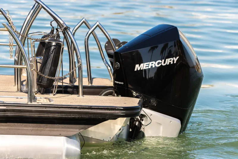 Slide: The Image of 2024 Barletta L23U boat with Mercury outboard motor on water. - 26