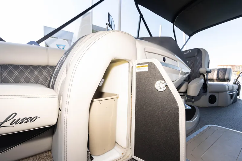 Slide: The Image of 2024 Barletta L23U boat interior with storage compartment and luxurious seating. - 33