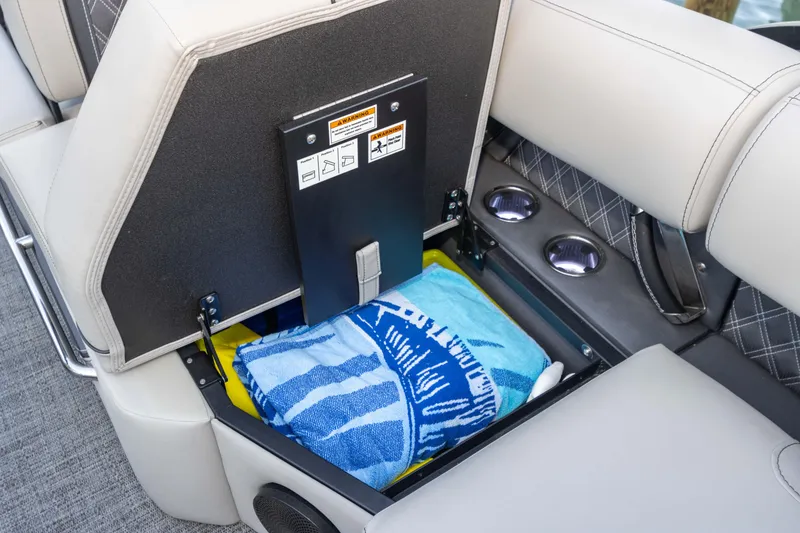 Slide: The Image of 2024 Barletta L23U boat seat storage with towels and cup holders. - 51