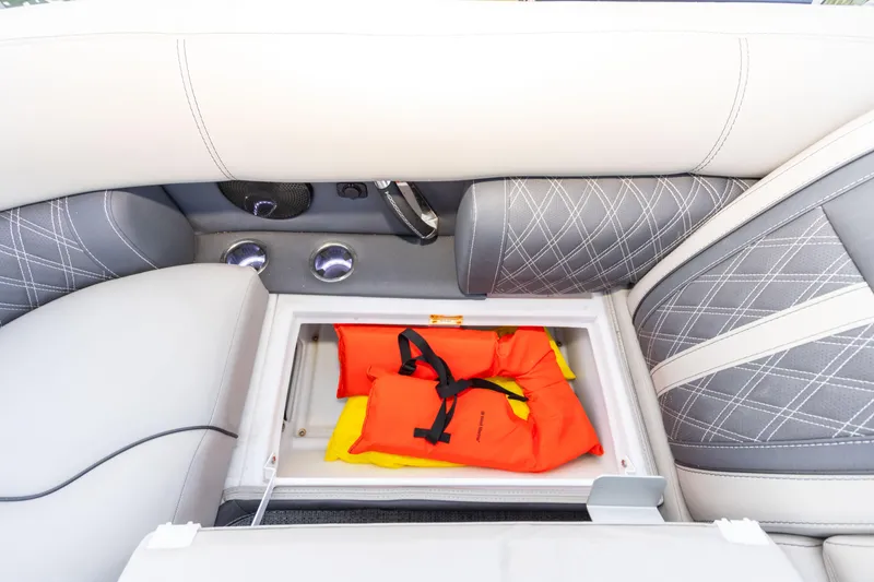 Slide: The Image of 2024 Barletta L23U boat seat storage with life jackets inside. - 53