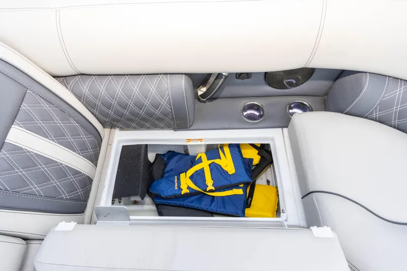 Slide: The Image of Storage compartment in 2024 Barletta L23U boat with life jackets inside. - 54