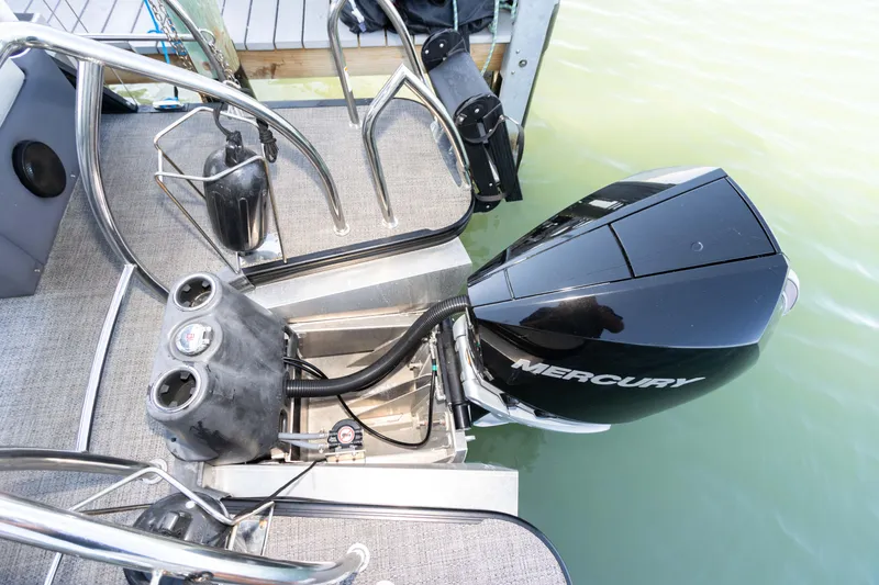 Slide: The Image of 2024 Barletta L23U boat with Mercury outboard motor at dock. - 57