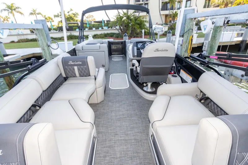 Slide: The Image of 2024 Barletta L23U pontoon boat interior with luxurious seating and modern helm. - 58