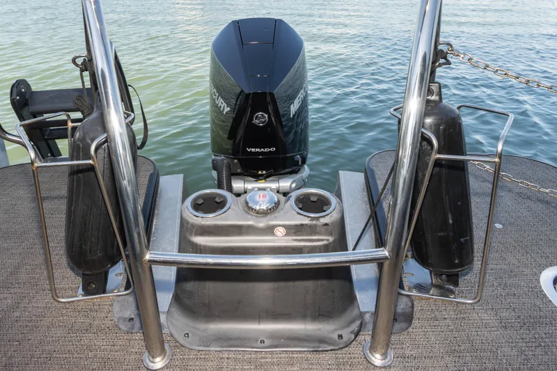 Slide: The Image of 2024 Barletta L23U boat with Mercury Verado engine on water. - 60