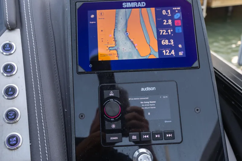 Slide: The Image of Control panel of 2024 Barletta L23U boat with Simrad navigation display. - 63