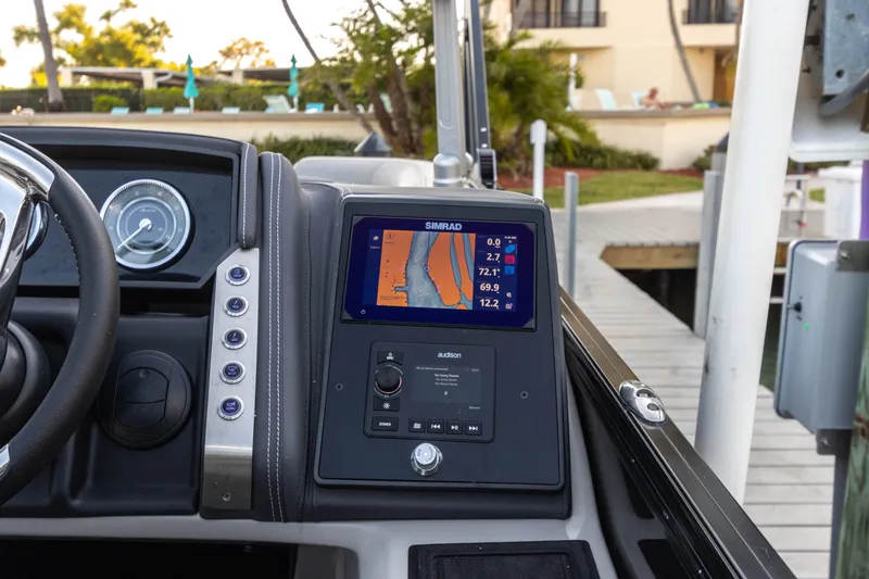 Slide: The Image of 2024 Barletta L23U boat dashboard with navigation display and control panel. - 66