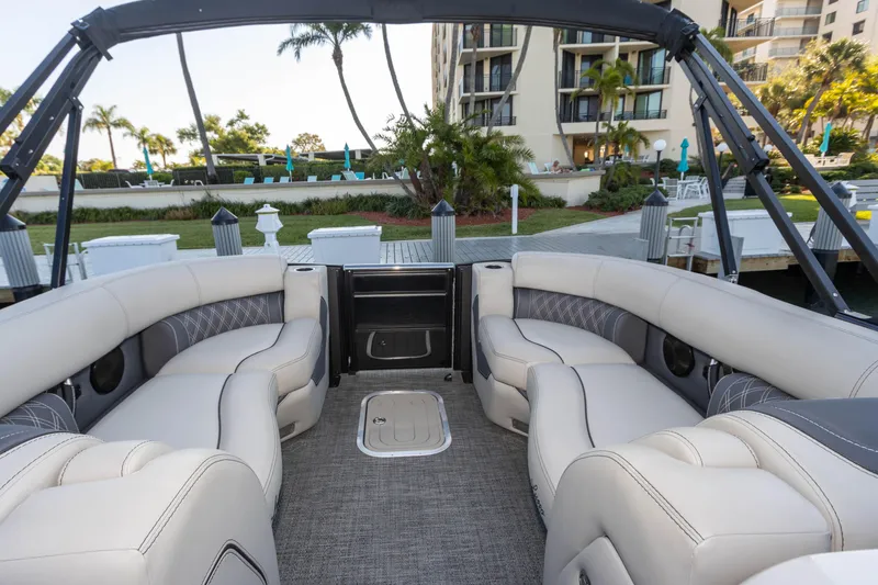 Slide: The Image of Luxurious interior of 2024 Barletta L23U pontoon boat with plush seating and elegant design. - 71