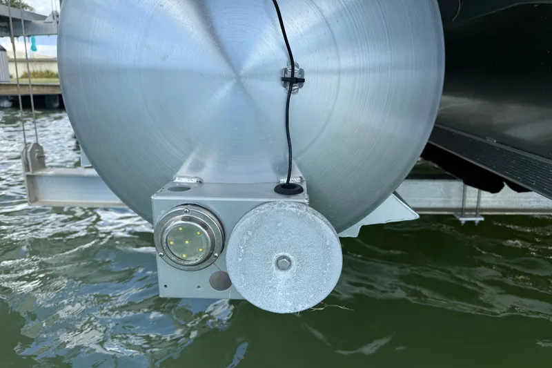 Slide: The Image of Close-up of 2024 Barletta L23U pontoon boat's underwater light and sensor. - 91