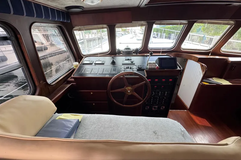 Slide: The Image of Interior of 1982 Custom Virpack Steel Hull boat with wooden steering wheel and control panel. - 15