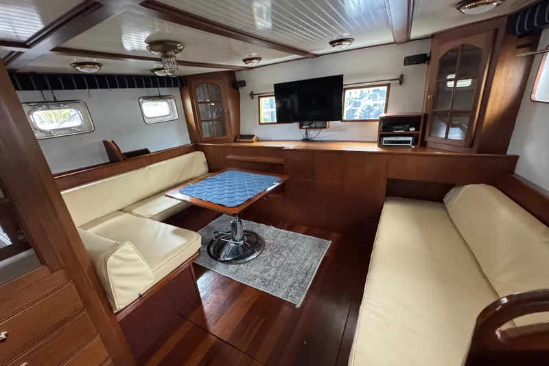 Slide: The Image of Luxurious 1982 Custom Virpack Steel Hull yacht interior with elegant wood and leather seating. - 28