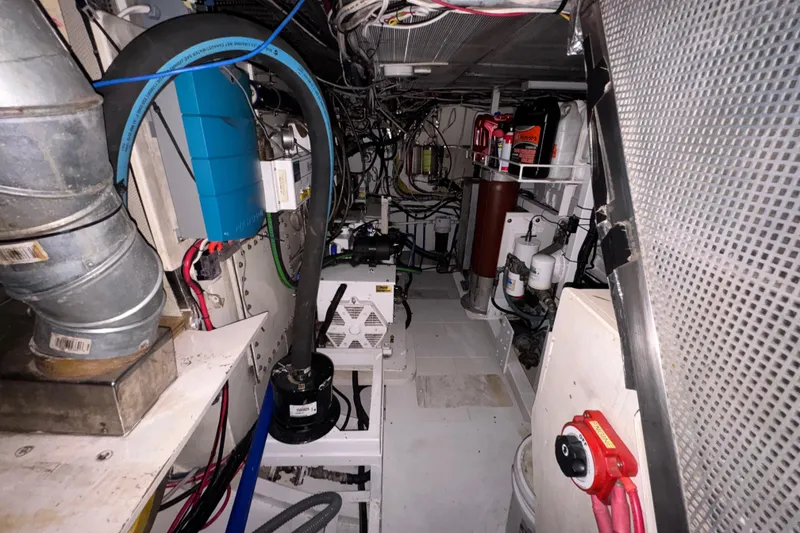 Slide: The Image of Engine room of 1982 Custom Virpack Steel Hull with complex wiring and machinery. - 36