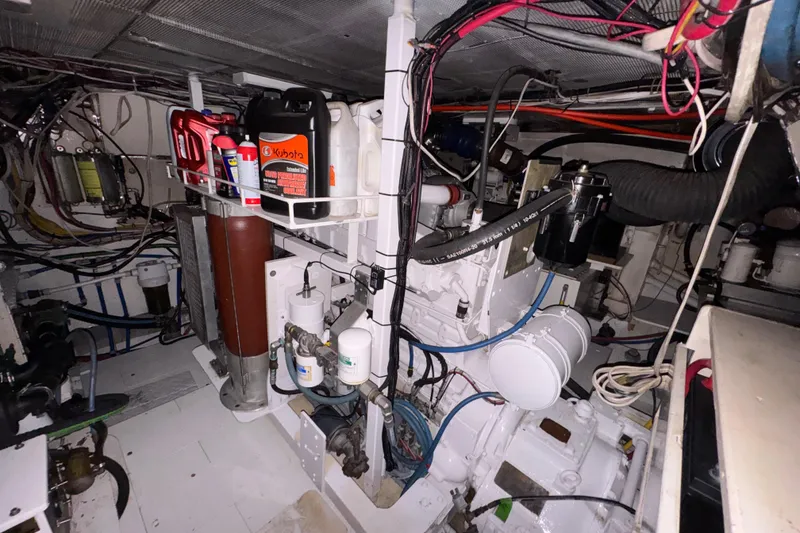 Slide: The Image of Engine room of 1982 Custom Virpack Steel Hull with various mechanical components and wiring. - 37