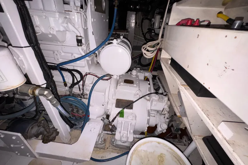 Slide: The Image of Engine room of 1982 Custom Virpack Steel Hull with visible machinery and wiring. - 38