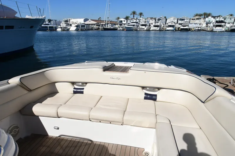 Slide: The Image of 2005 Chris-Craft Corsair 28 boat interior with beige seating, docked at marina. - 13