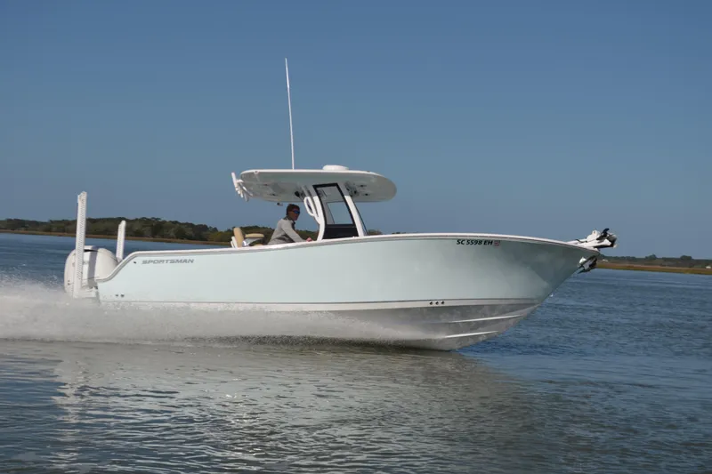 The Image of 2026 Sportsman Open 252 Center Console boat cruising on calm water. - 1
