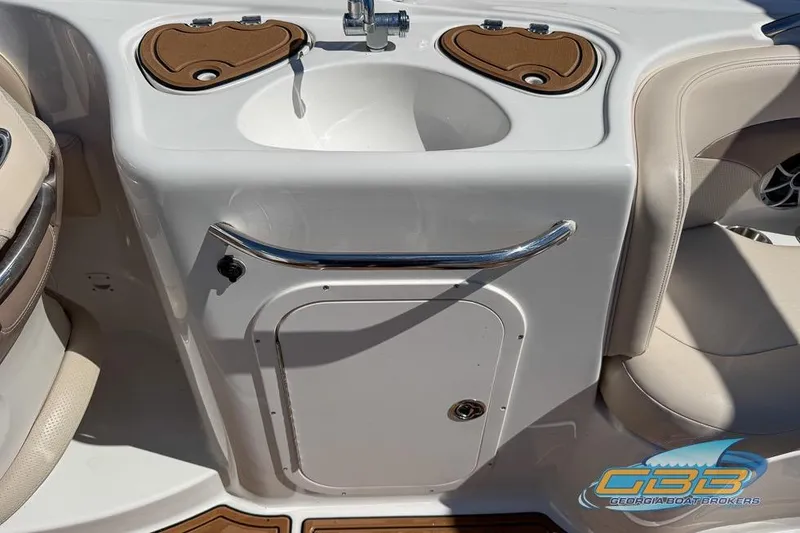 Slide: The Image of 2006 Chaparral Sunesta 274 boat interior with sink and seating area. - 17