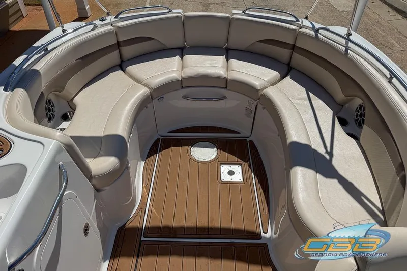 Slide: The Image of 2006 Chaparral Sunesta 274 boat interior with spacious seating and teak flooring. - 18