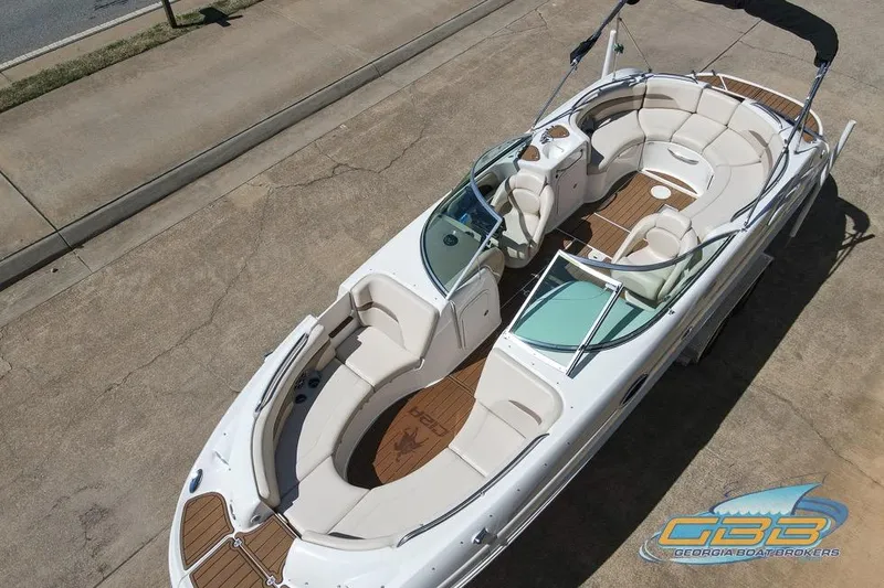 Slide: The Image of 2006 Chaparral Sunesta 274 boat with spacious seating and sleek design on display. - 2