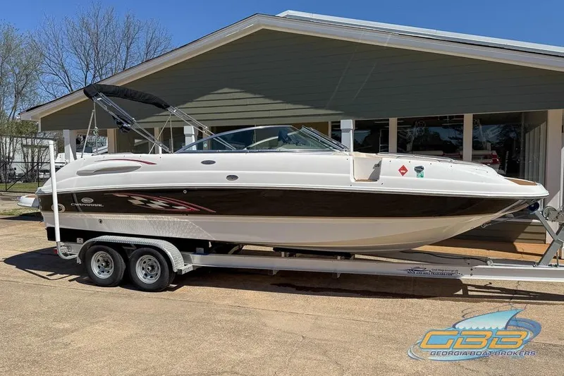 Slide: The Image of 2006 Chaparral Sunesta 274 boat on trailer, parked outside a house. - 21
