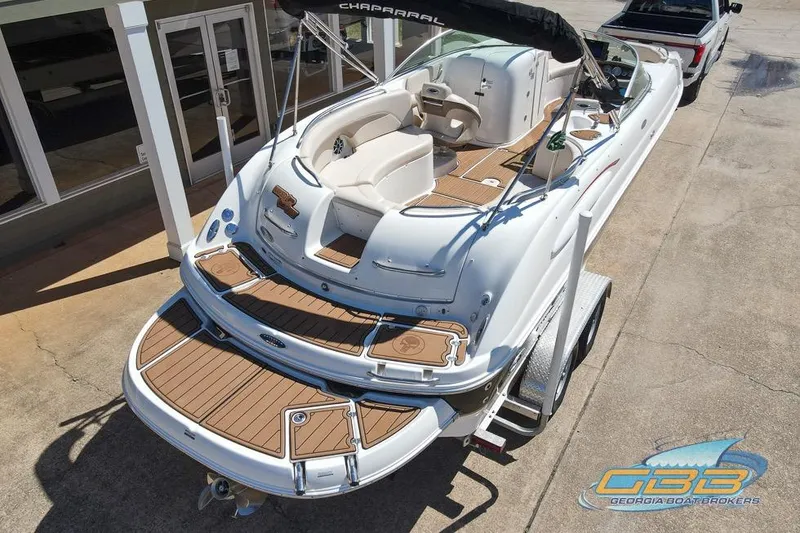 Slide: The Image of 2006 Chaparral Sunesta 274 boat on trailer, featuring spacious deck and seating. - 26