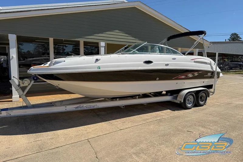 Slide: The Image of 2006 Chaparral Sunesta 274 boat on trailer outside a building. - 5