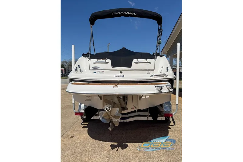 Slide: The Image of 2006 Chaparral Sunesta 274 boat, rear view with canopy and propeller. - 7