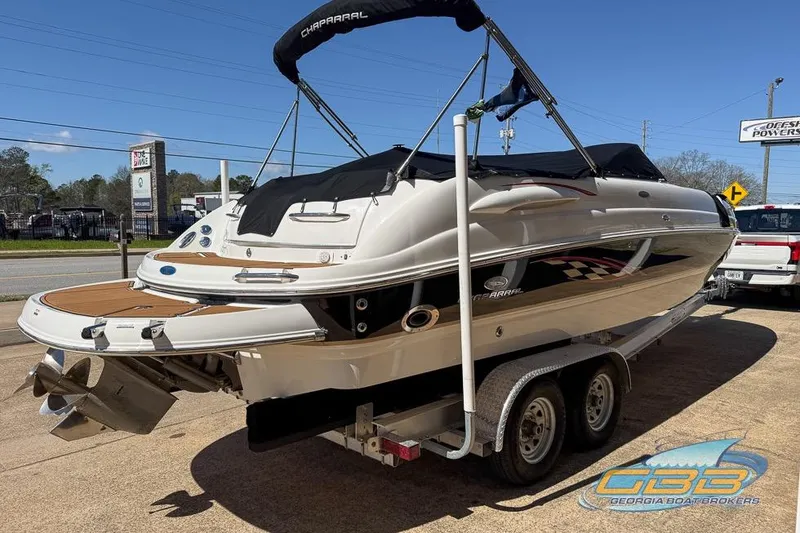Slide: The Image of 2006 Chaparral Sunesta 274 boat on trailer, displayed outdoors at Georgia Boat Brokers. - 8