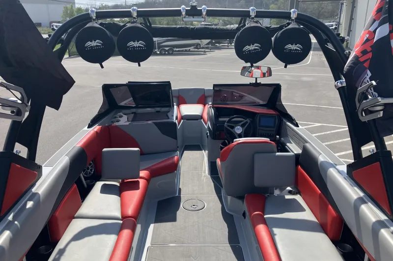 Slide: The Image of 2020 ATX Surf Boats 24 Type-S interior with red and gray seating, advanced dashboard. - 14