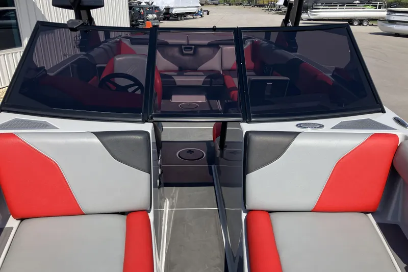Slide: The Image of 2020 ATX Surf Boats 24 Type-S interior with red and gray seating, open windshield view. - 15